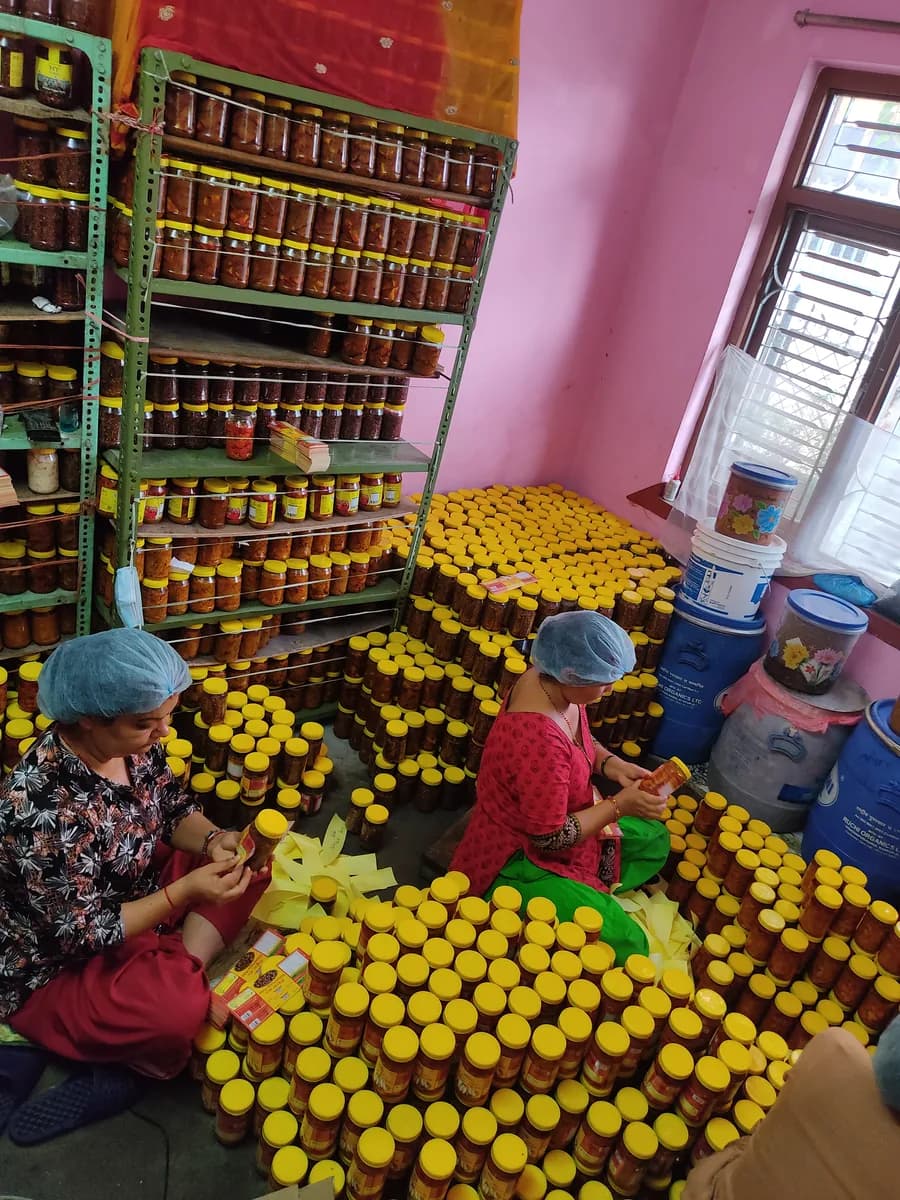 My Pickle House team packing yellow-lid jars